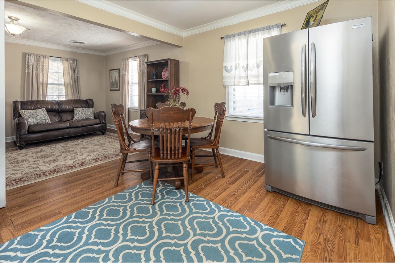 456 Gerald Road Memphis, TN 38122 - Photo 10 of 25 a view of a dining room with furniture a rug and wooden floor