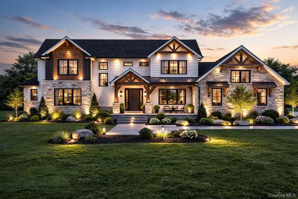 a front view of a house with a garden