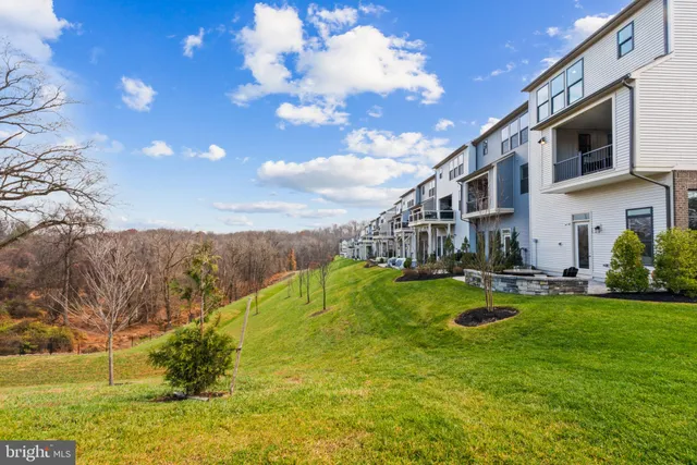 a swimming pool with the view of trees in the background