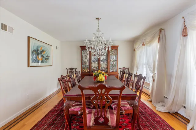 a spacious bedroom with a large bed and a large window