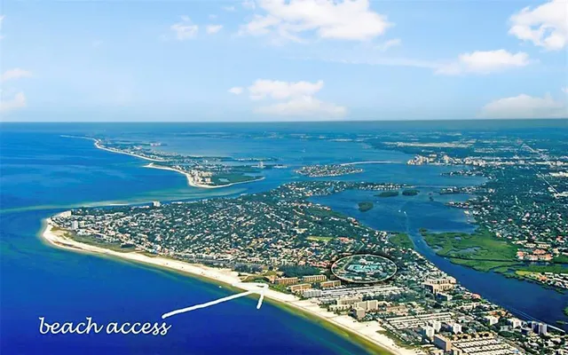a view of a lake with a house in the background