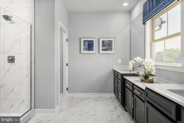 a kitchen with stainless steel appliances granite countertop a sink and a granite counter tops