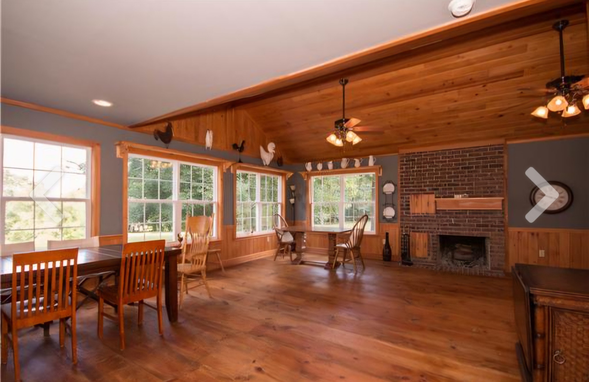 2769 New Hall Road Greenbrier, TN 37073 - Photo 11 of 58 a living room with furniture a dining table and a fireplace