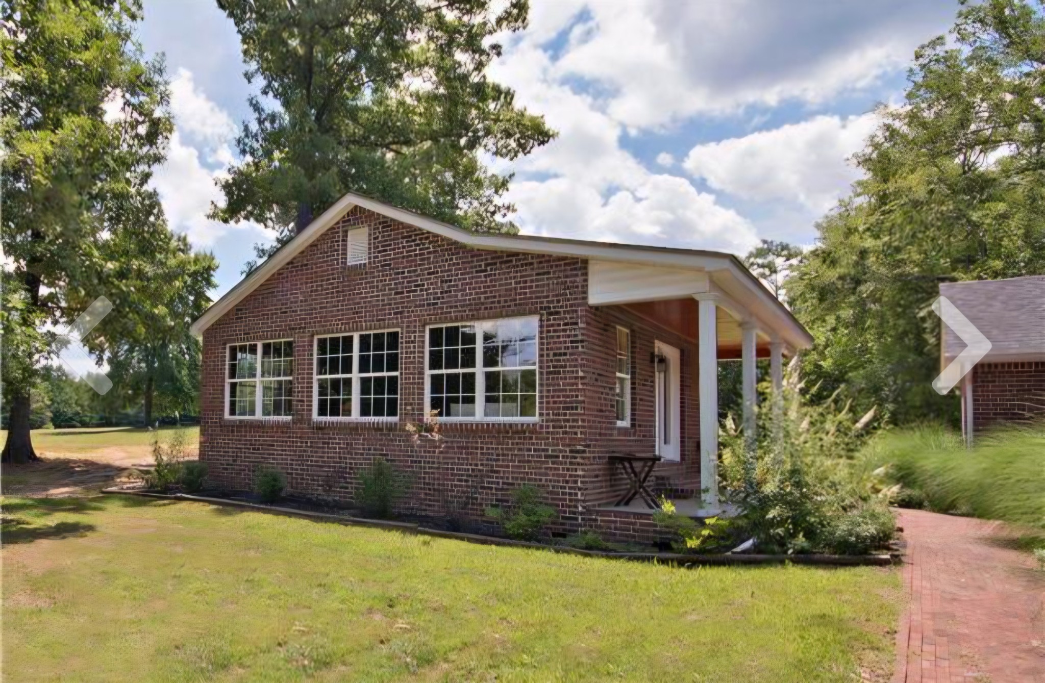 2769 New Hall Road Greenbrier, TN 37073 - Photo 12 of 58 a front view of a house with a yard and trees