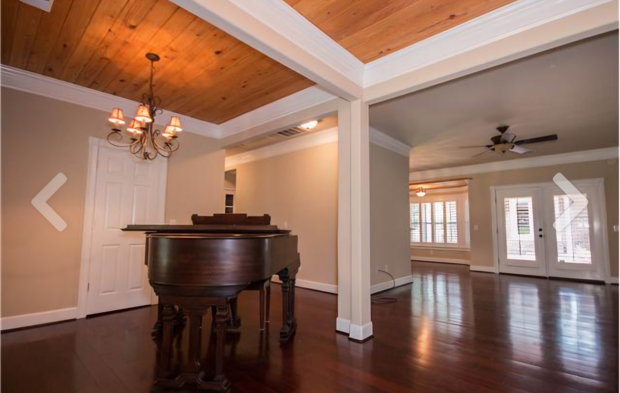 2769 New Hall Road Greenbrier, TN 37073 - Photo 9 of 58 a dining room with wooden floor a chandelier a glass table and chairs
