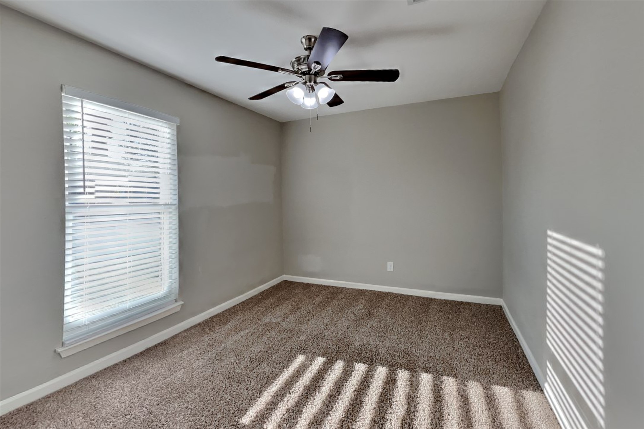 2527 Anthony-Hay Lane Katy, TX 77449 - Photo 13 of 18 wooden floor in an empty room with a window