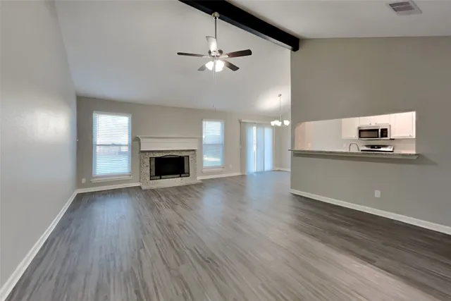 a view of a kitchen with a sink and a fireplace