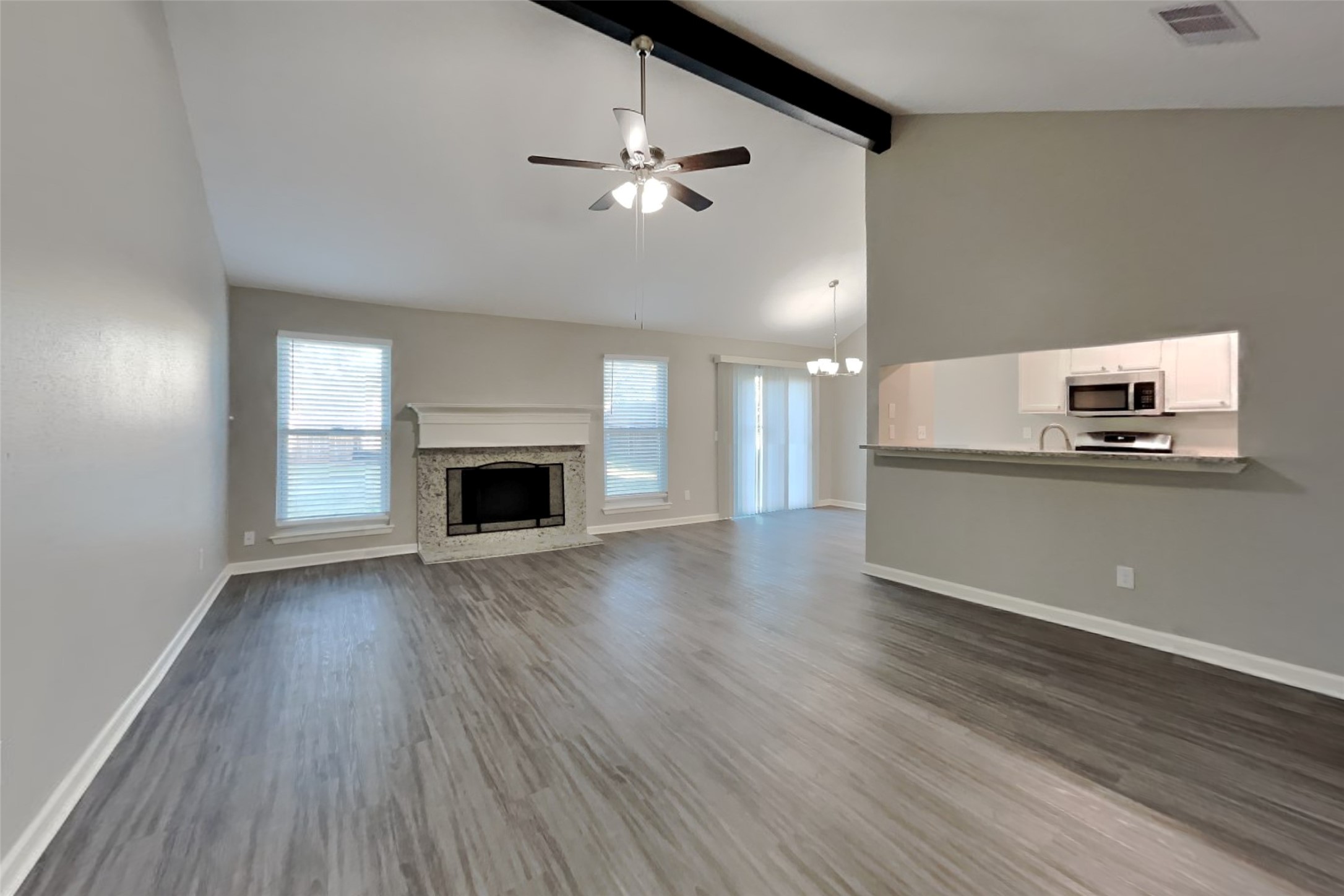 2527 Anthony-Hay Lane Katy, TX 77449 - Photo 2 of 18 a view of a kitchen with a sink and a fireplace