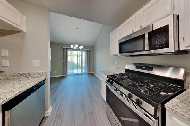 a kitchen with a stove and a microwave