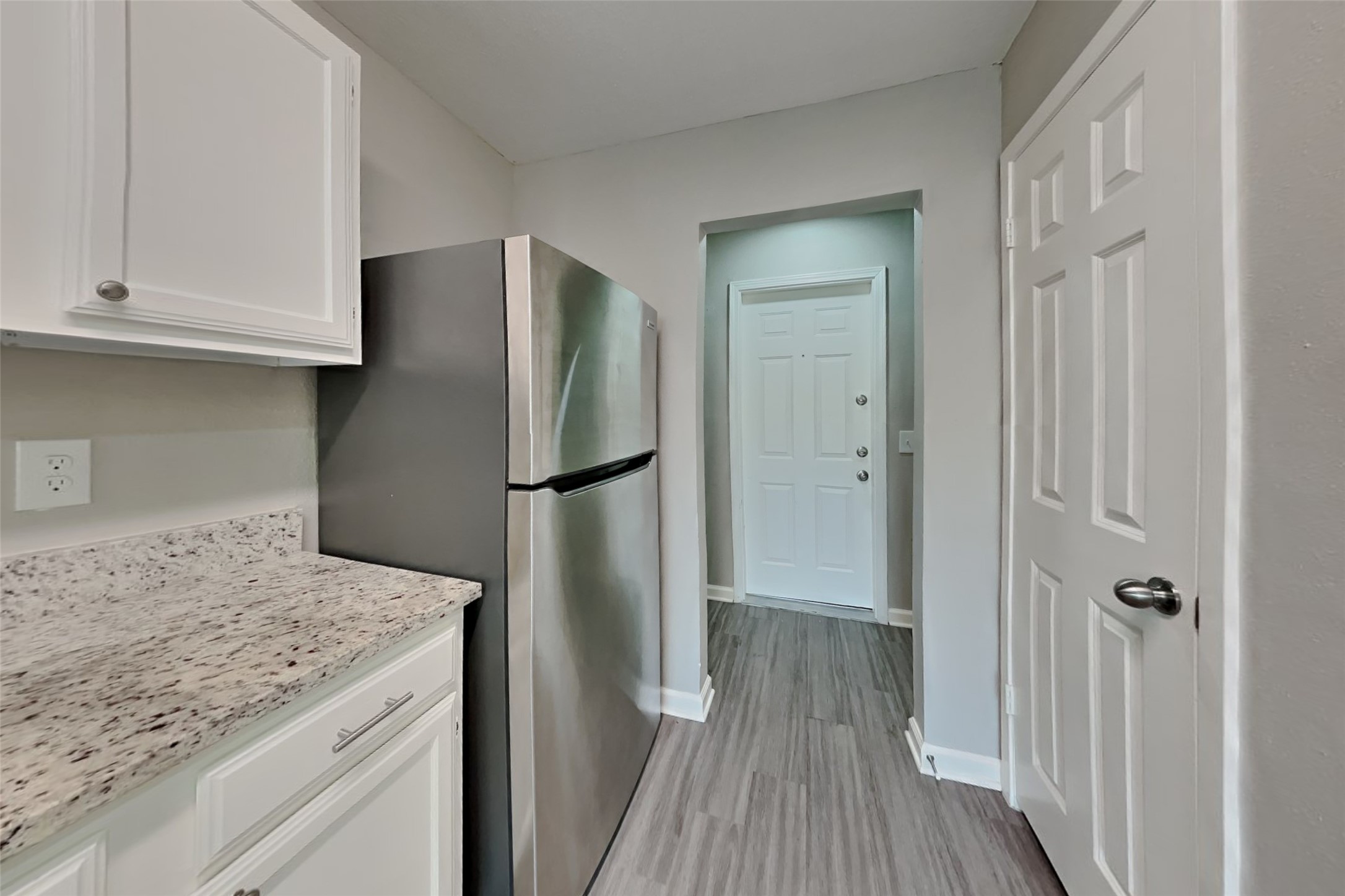 2527 Anthony-Hay Lane Katy, TX 77449 - Photo 5 of 18 a kitchen with a refrigerator and cabinets