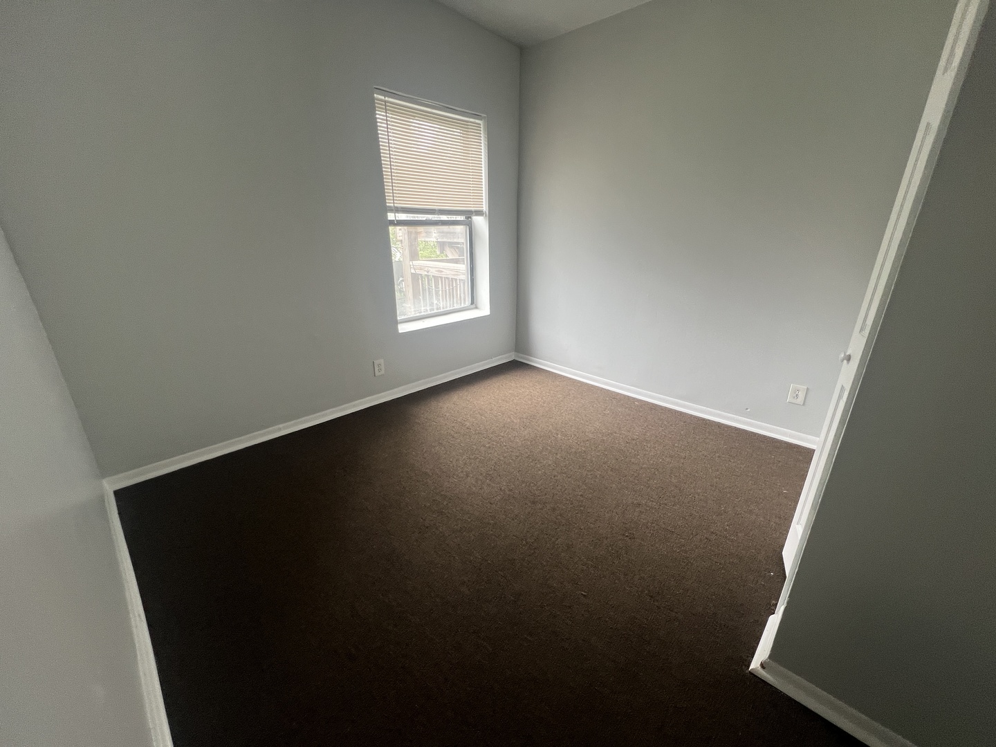 71 East 69th Street, Unit 2 Chicago, IL 60637 - Photo 4 of 6 an empty room with windows