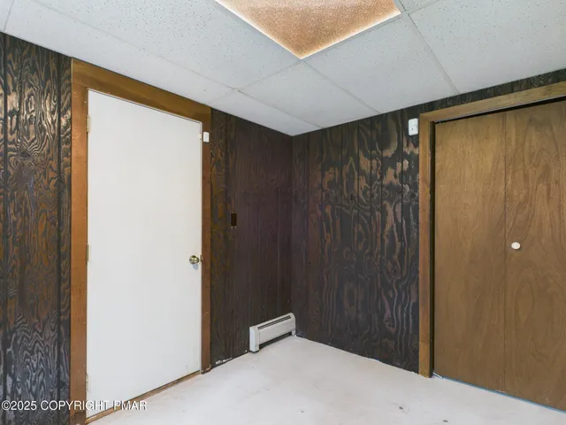 a bathroom with a toilet a sink and a mirror