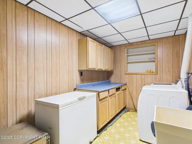 a view of a hallway with washer and dryer