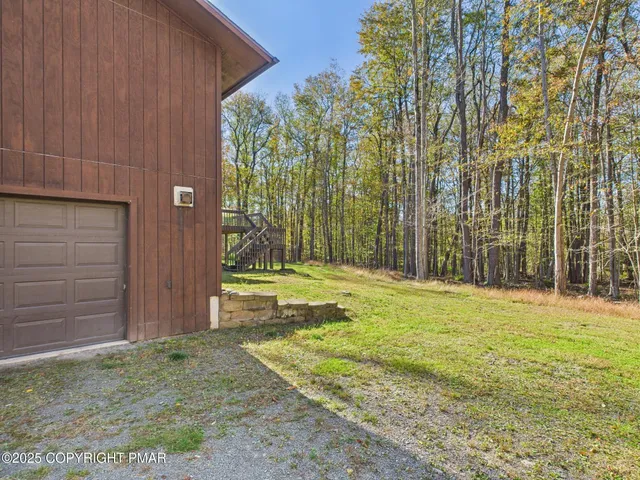 a living room with fireplace a table and a fireplace