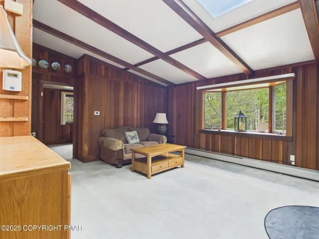 a view of a dining room with furniture window and outside view