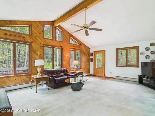 a living room with furniture and a window