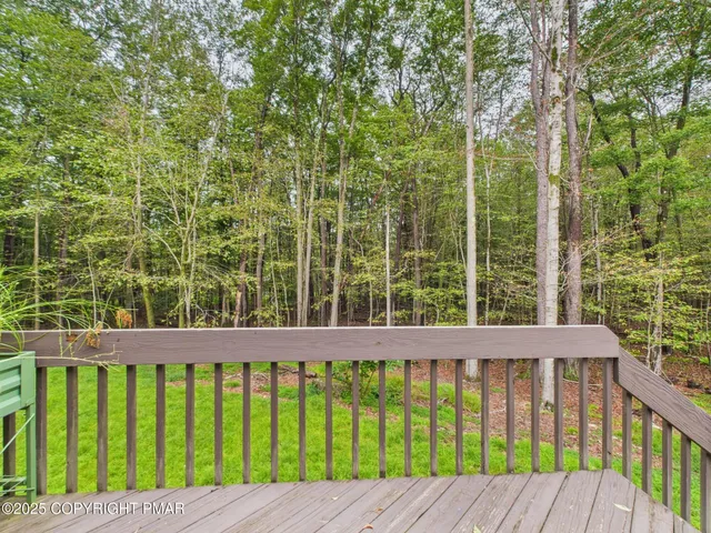 a view of swimming pool with a house in the background