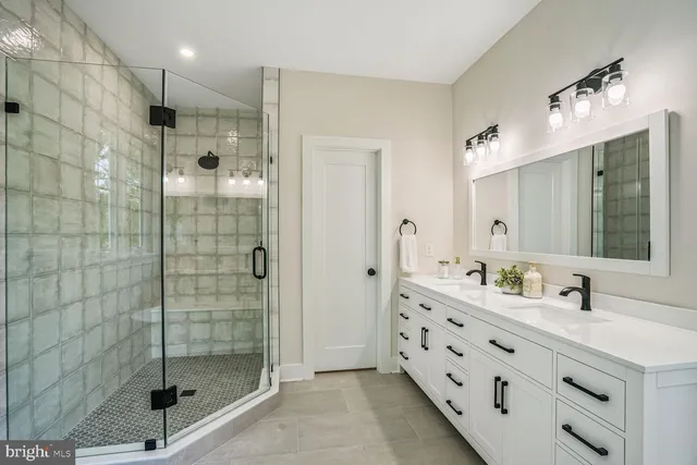 a bathroom with a double vanity sink mirror and double