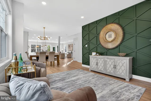 a living room with furniture and a clock