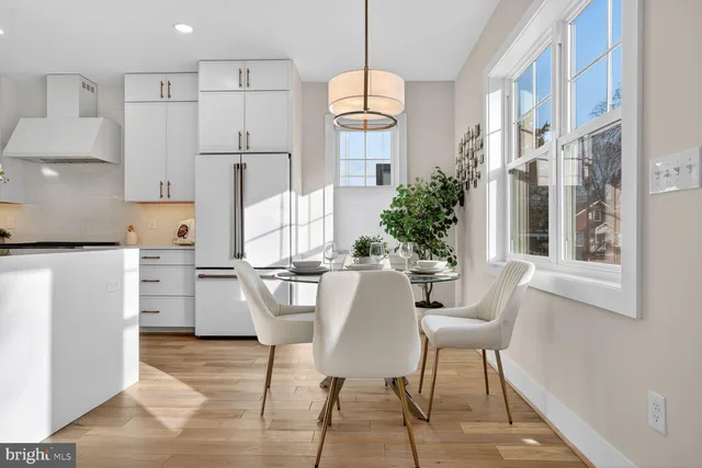 a view of a dining room with furniture and window