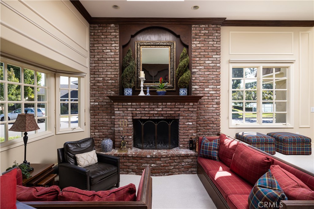 1901 Windward Lane Newport Beach, CA 92660 - Photo 15 of 52 a living room with furniture mirror and fireplace