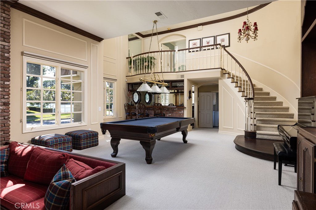 1901 Windward Lane Newport Beach, CA 92660 - Photo 16 of 52 a living room with furniture a fireplace and a window