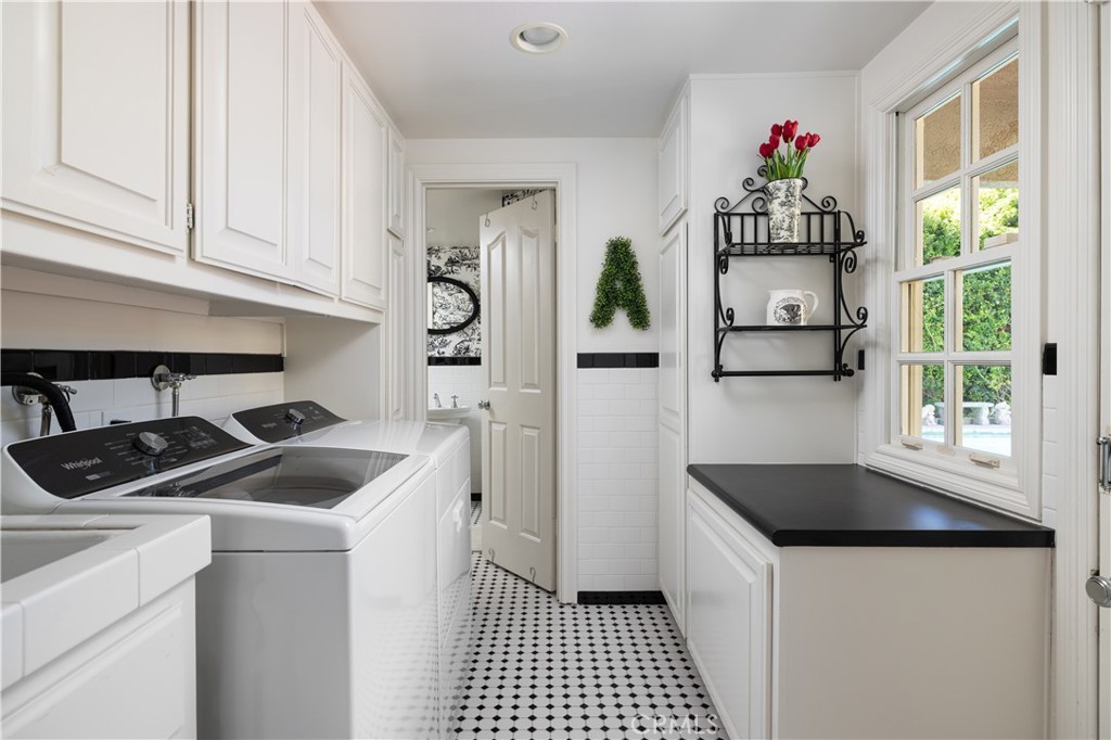 1901 Windward Lane Newport Beach, CA 92660 - Photo 22 of 52 a kitchen that has a sink cabinets counter space and appliances