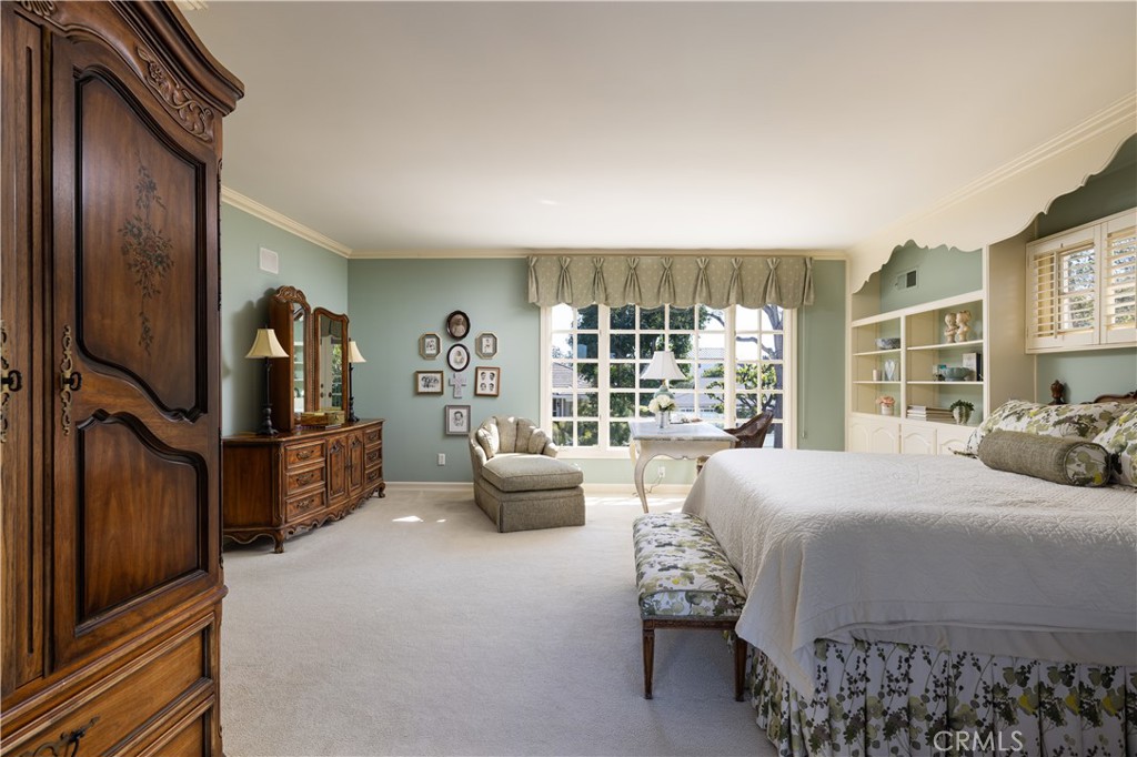 1901 Windward Lane Newport Beach, CA 92660 - Photo 25 of 52 a bedroom with a large bed and a large window