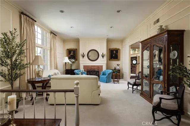 a view of a hallway with wooden floor and stairs