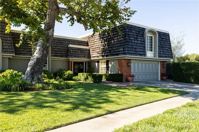 a view of a house with a yard porch and sitting area