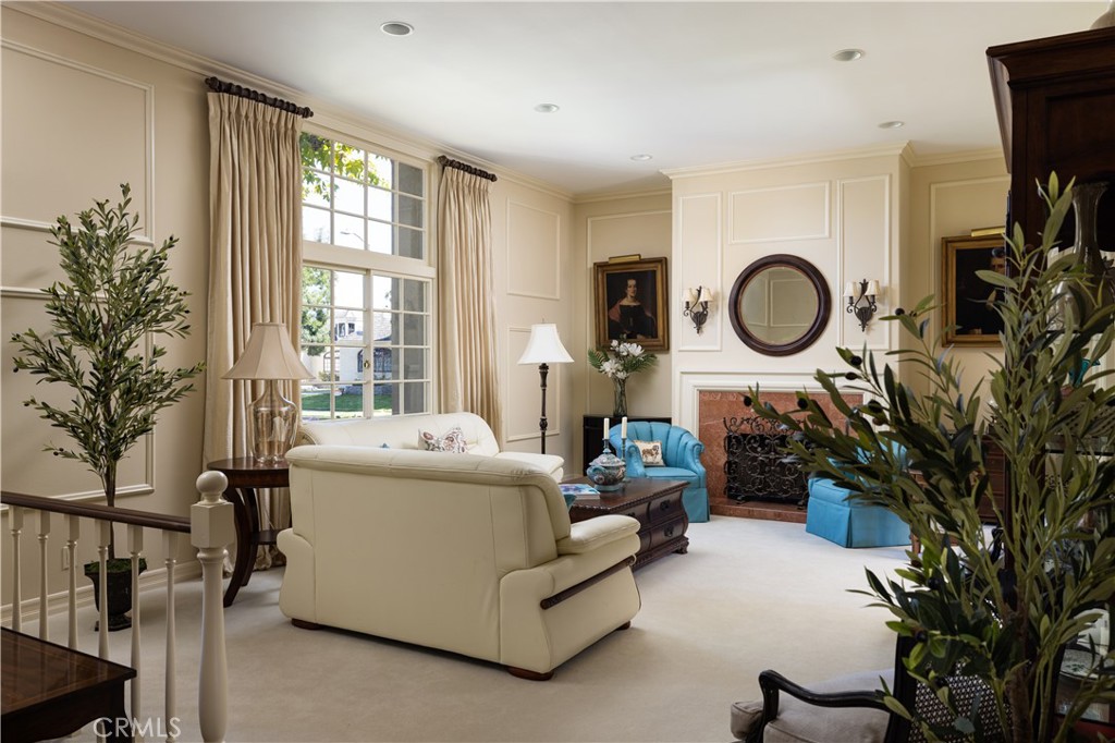 1901 Windward Lane Newport Beach, CA 92660 - Photo 31 of 52 a living room with furniture a window and a clock