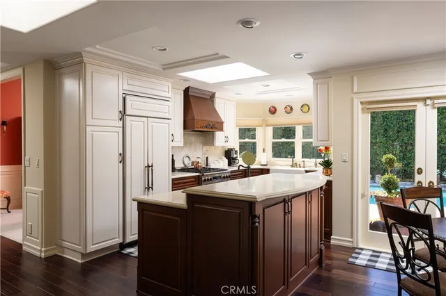a kitchen with a stove a sink and a cabinets