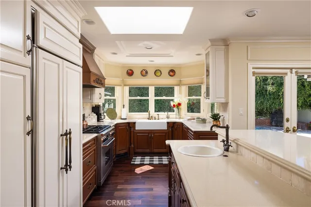 a view of a dining room with furniture large windows and wooden floor