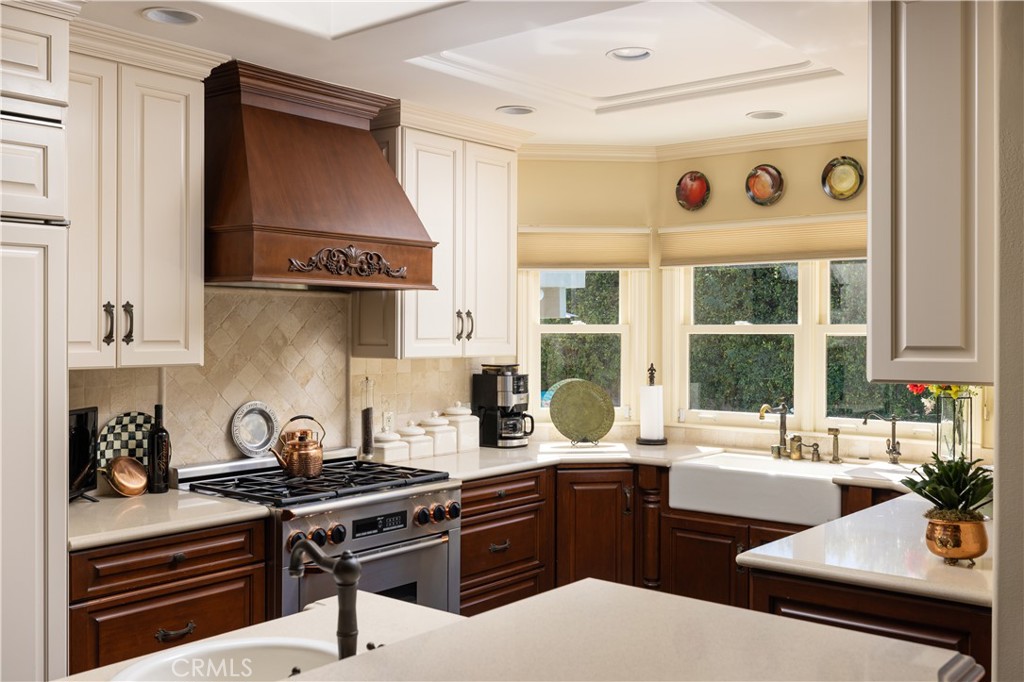 1901 Windward Lane Newport Beach, CA 92660 - Photo 35 of 52 a kitchen with a stove a sink and a cabinets