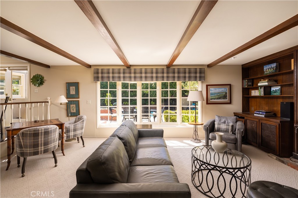 1901 Windward Lane Newport Beach, CA 92660 - Photo 38 of 52 a living room with furniture and a floor to ceiling window