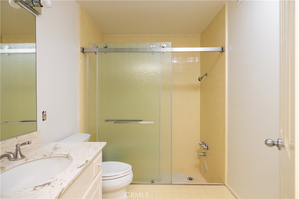 1901 Windward Lane Newport Beach, CA 92660 - Photo 45 of 52 a bathroom with a granite countertop shower sink vanity mirror and toilet