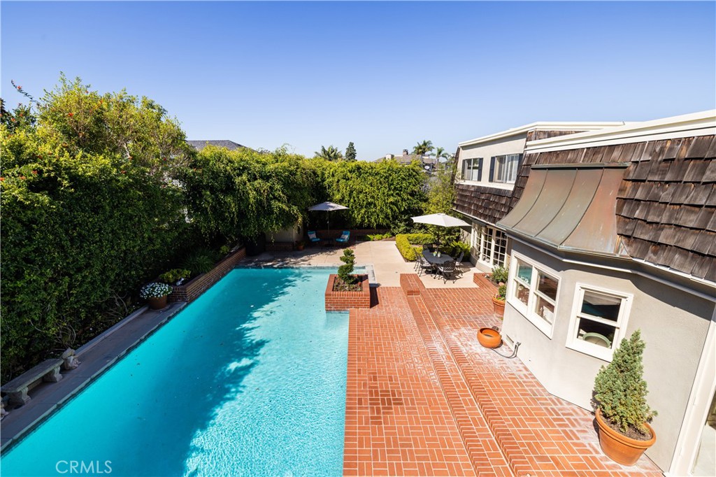 1901 Windward Lane Newport Beach, CA 92660 - Photo 46 of 52 a view of a swimming pool with a patio