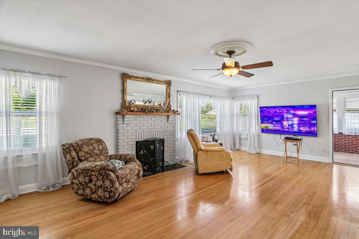 321 North 3rd Street Oakland, MD 21550 - Photo 11 of 48 a living room with furniture a fireplace and a flat screen tv