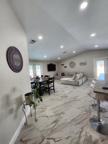 a kitchen with sink stove and refrigerator