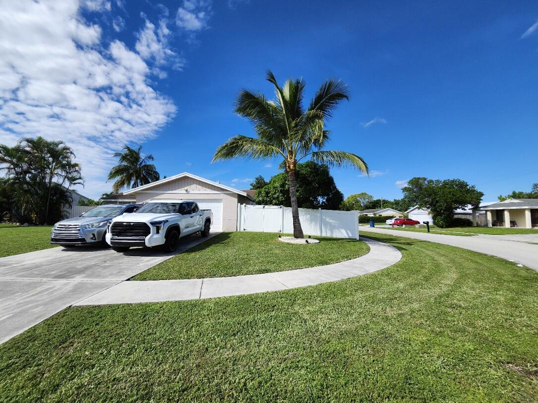 1473 Donwoods Lane Royal Palm Beach, FL 33411 - Photo 2 of 95 Driveway