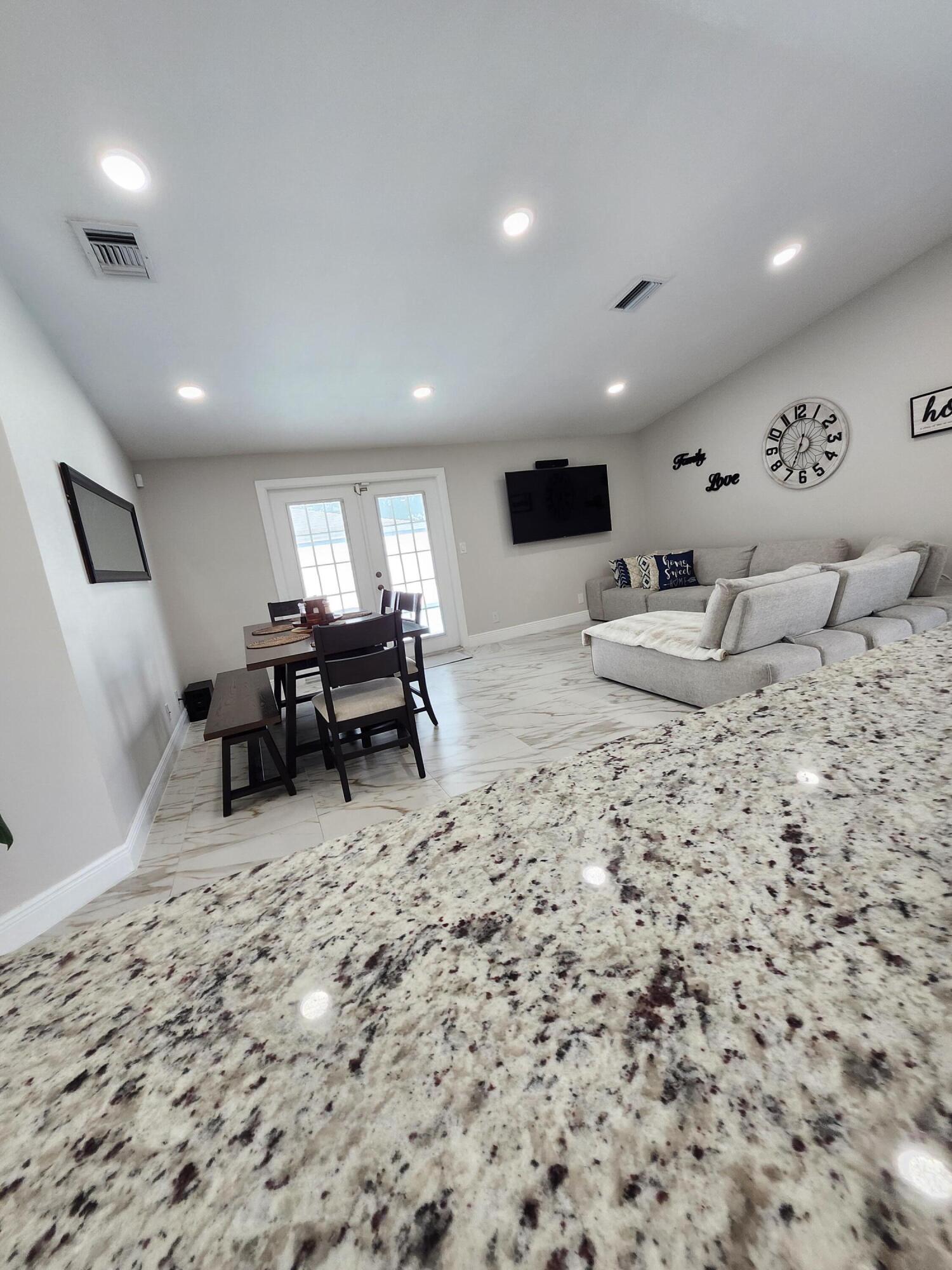 1473 Donwoods Lane Royal Palm Beach, FL 33411 - Photo 21 of 95 a living room with furniture and a wooden floor