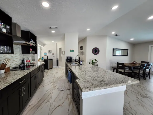 a bedroom with a large bed and a flat screen tv