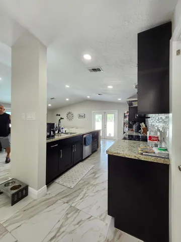 a bedroom with a bed and a walk in closet