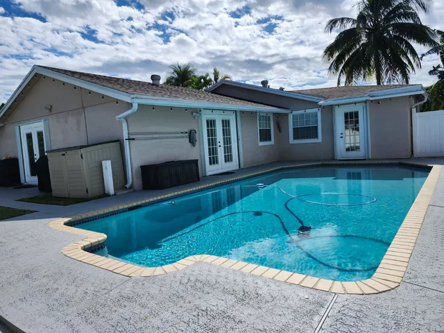 a view of a livingroom with an empty space and a fireplace