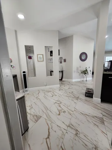 a bathroom with a double vanity sink and mirror