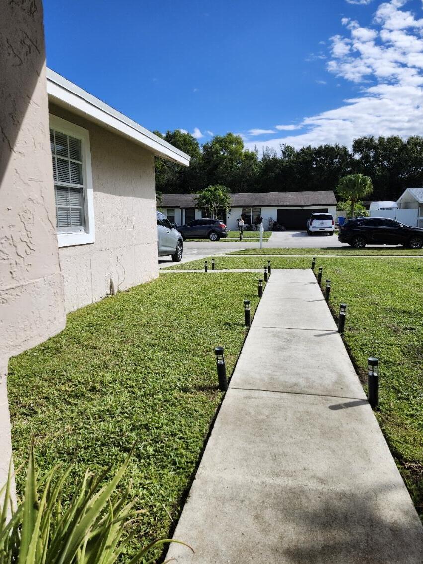 1473 Donwoods Lane Royal Palm Beach, FL 33411 - Photo 6 of 95 a view of outdoor space yard and swimming pool