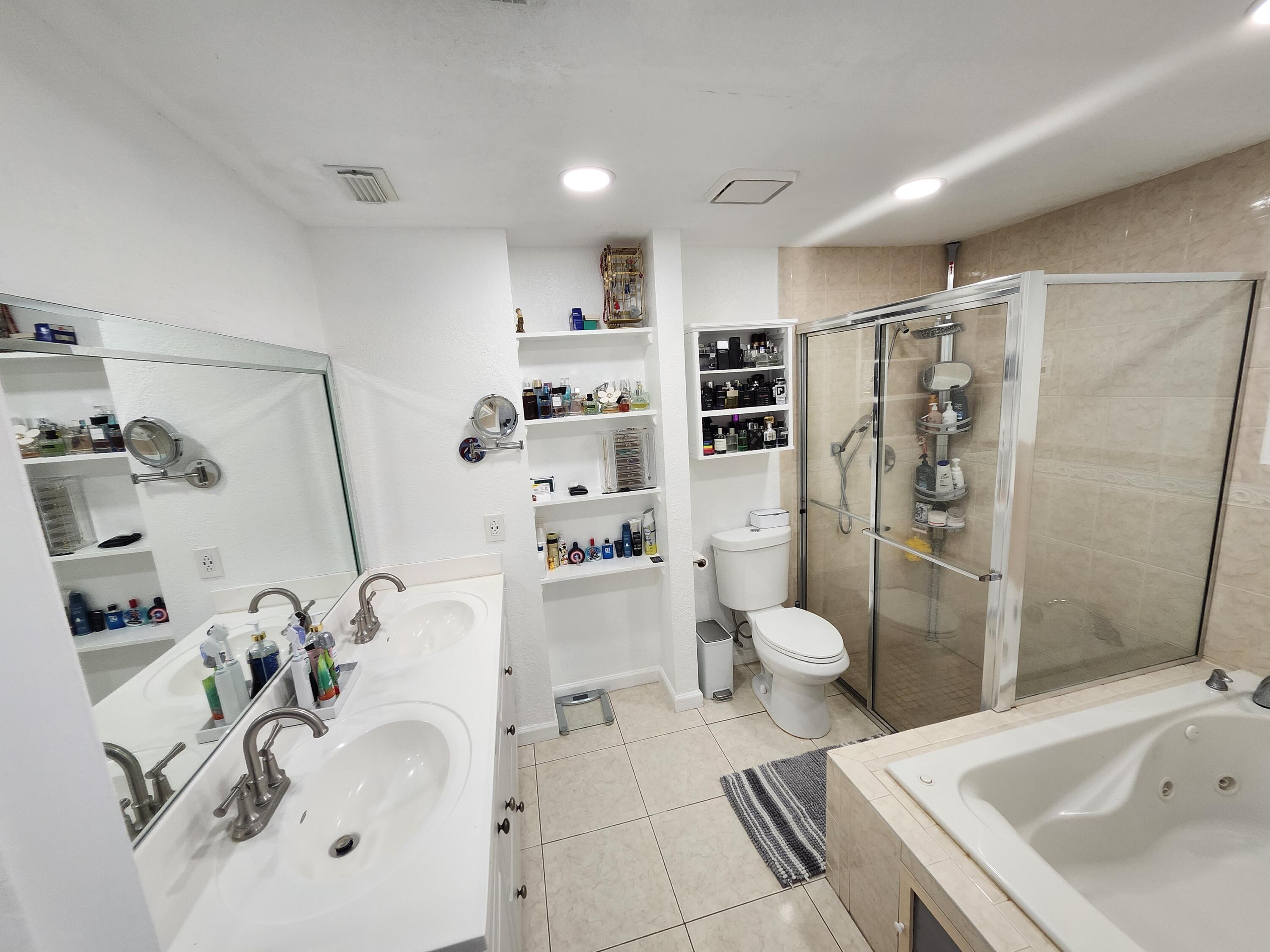 1473 Donwoods Lane Royal Palm Beach, FL 33411 - Photo 75 of 95 a bathroom with a sink toilet and shower