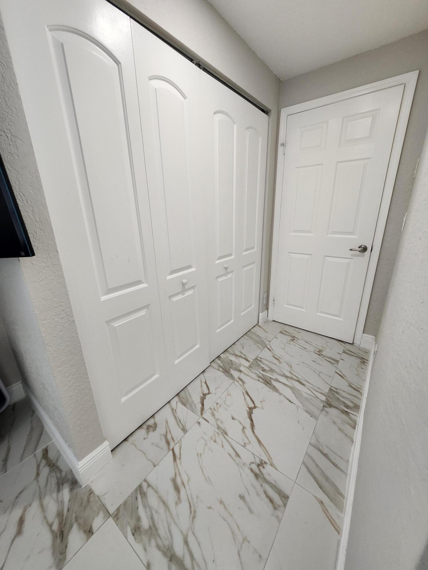 1473 Donwoods Lane Royal Palm Beach, FL 33411 - Photo 84 of 95 a view of a closet