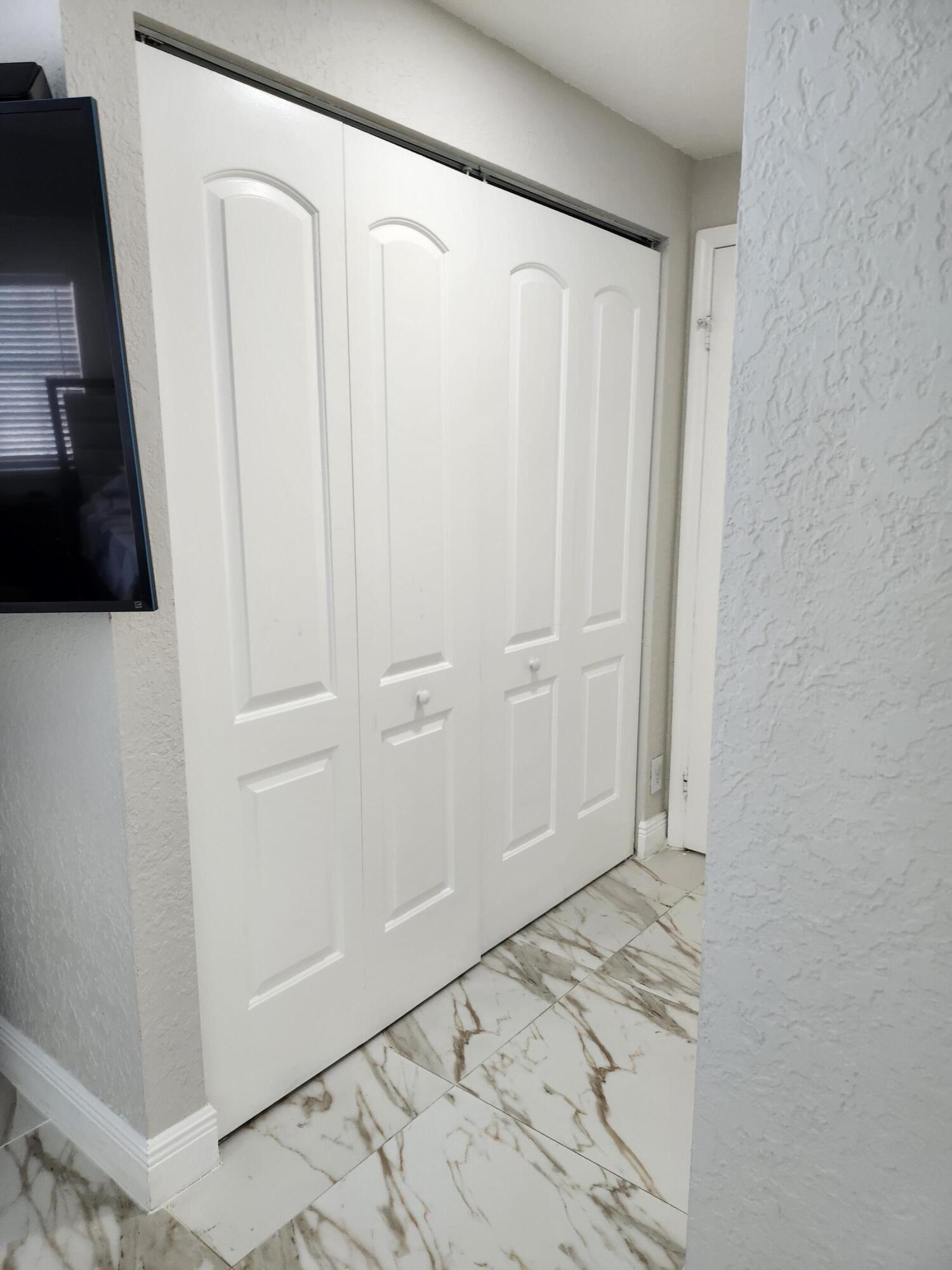 1473 Donwoods Lane Royal Palm Beach, FL 33411 - Photo 85 of 95 a view of a closet