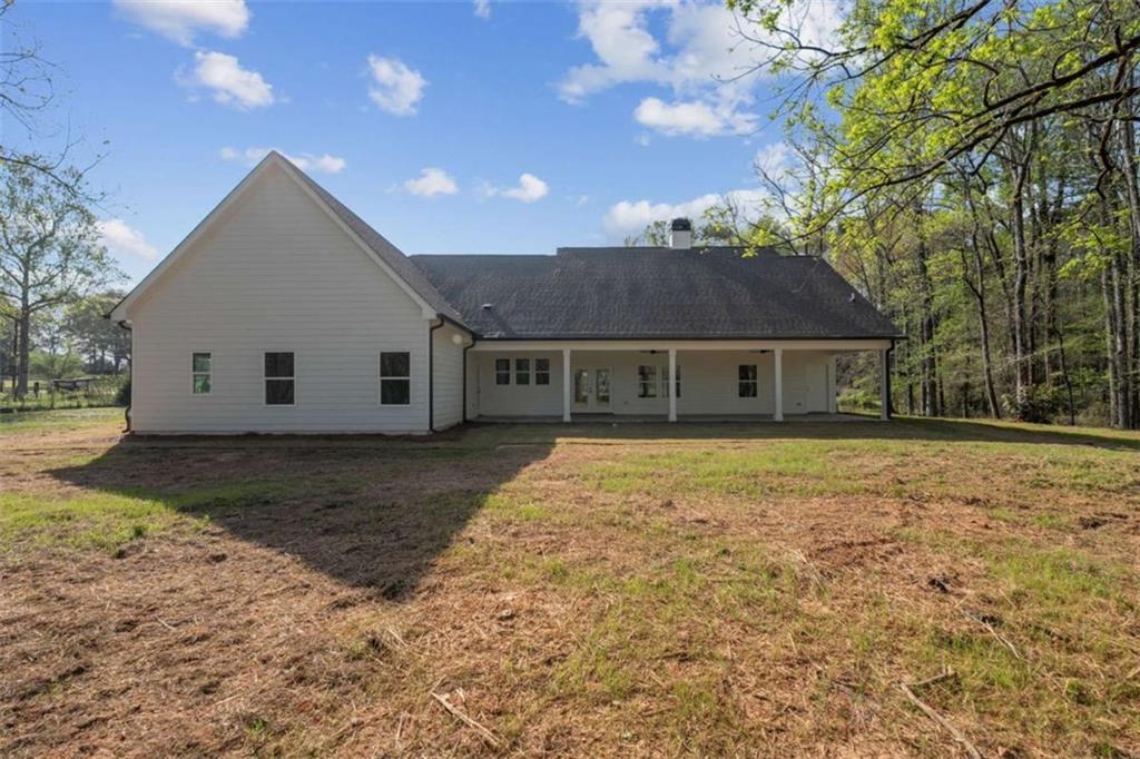 11691 Hazelbrand Road Northeast Covington, GA 30014 - Photo 42 of 53 a view of a house with a yard